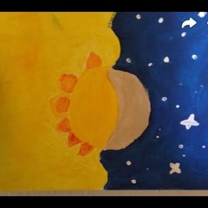This is a hand painting of haft of a sun and moon